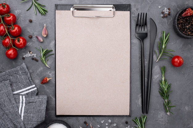 Top view fresh vegetables beside clipboard