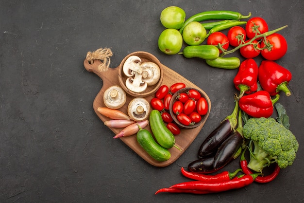 Top view fresh vegetables composition on a dark background