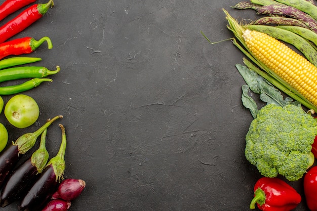 Top view fresh vegetables composition on grey background