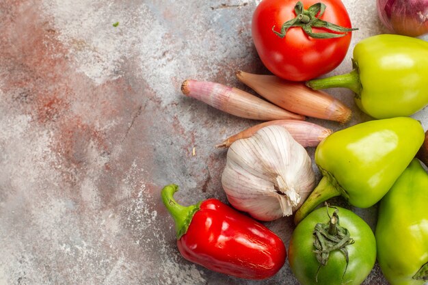 Top view fresh vegetables composition on a white background