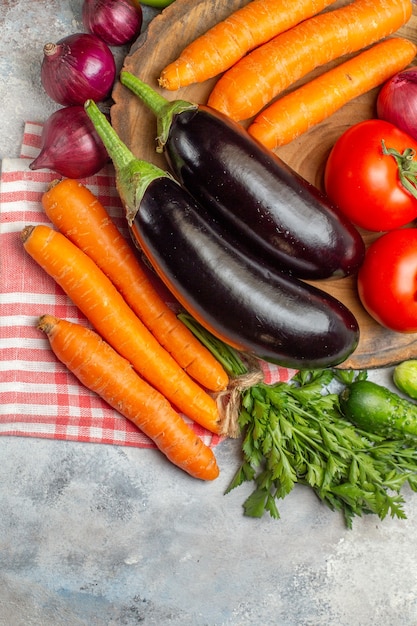 Top view fresh vegetables composition on a white background