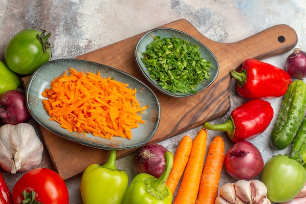 Top view fresh vegetables composition on the white background