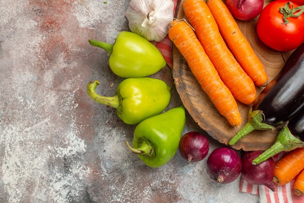 Top view fresh vegetables composition on white background