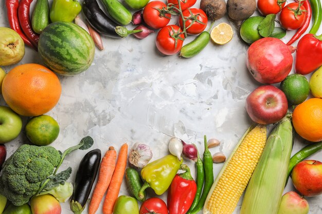 Top view fresh vegetables composition on a white background