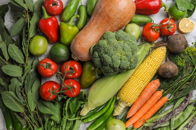 Top view fresh vegetables composition on the white background