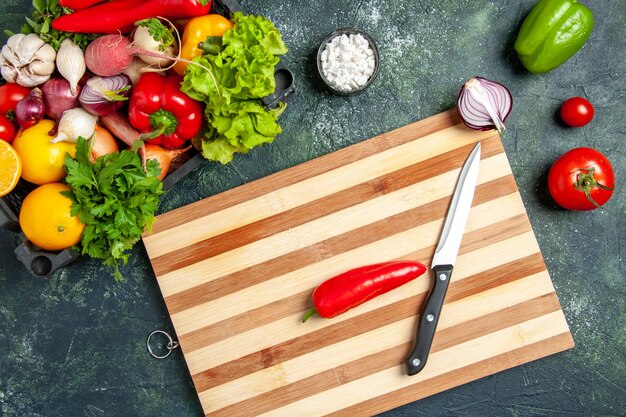 Top view fresh vegetables on the gray background food cooking color salad kitchen cuisine meal