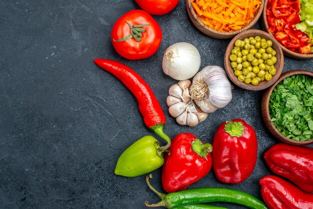 Top view fresh vegetables with garlic on a dark table salad meal ripe color