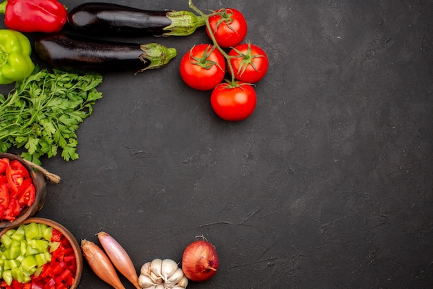 Top view fresh vegetables with greens on grey background meal salad health food