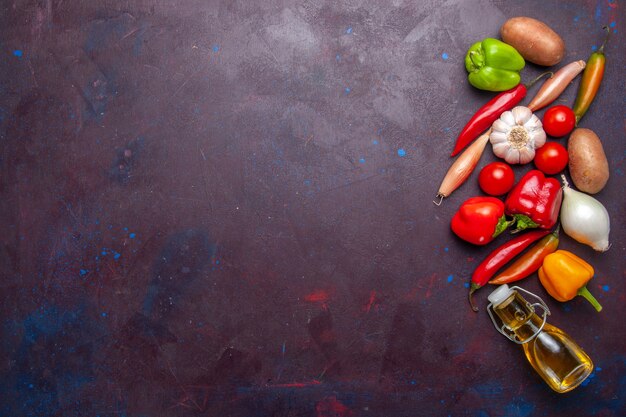 Top view fresh vegetables with olive oil on dark background meal food vegetable ingredient