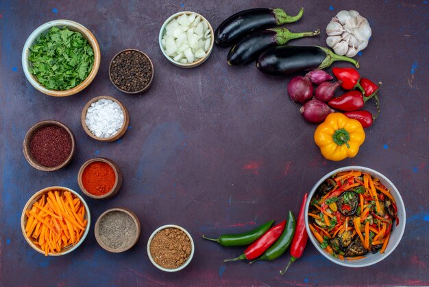 Top view fresh vegetables with salad and seasonings on dark background salad food meal vegetable snack