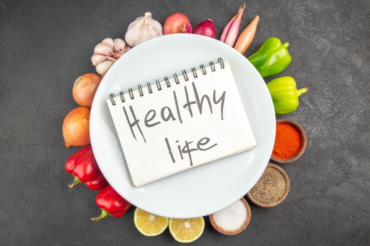 Free Photo top view fresh vegetables with seasonings and healthy life writing on grey background