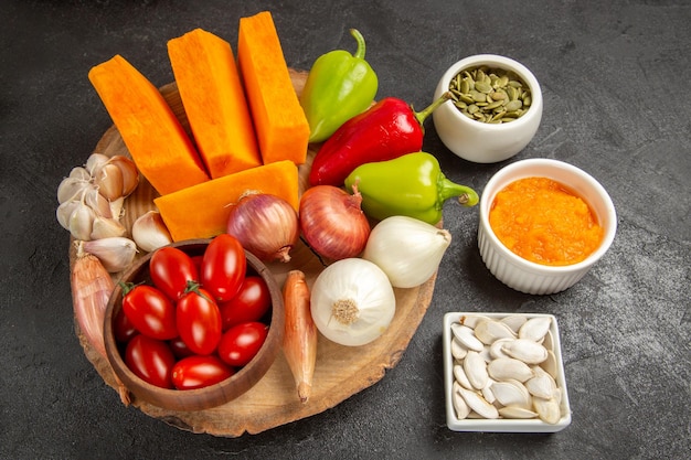 Top view fresh vegetables with sliced pumpkin on grey background ripe salad color fresh