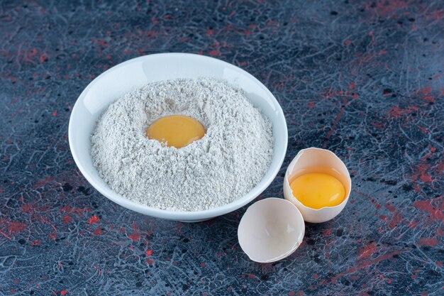 Top view of fresh white chicken egg broken with yolk and egg white 