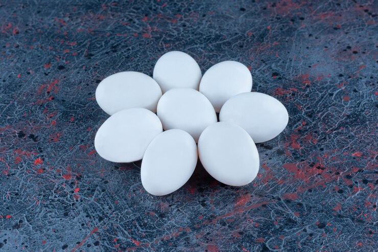 Free Photo top view of fresh white chicken eggs 