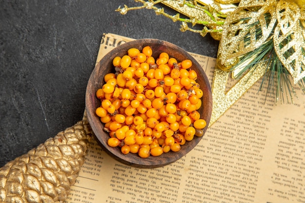 Top view fresh yellow berries on dark background