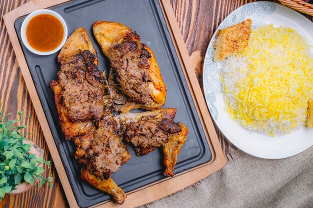 Top view fried chicken lavangi with sauce and rice