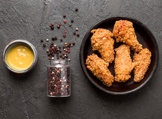 Top view fried chicken with pepper and sauce