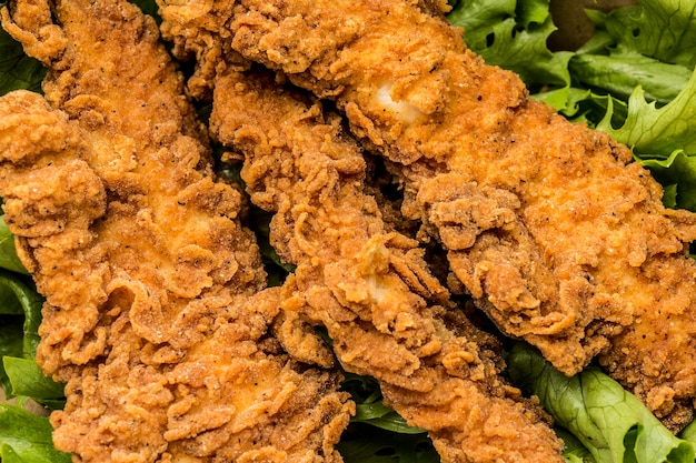 Free photo top view fried chicken with salad