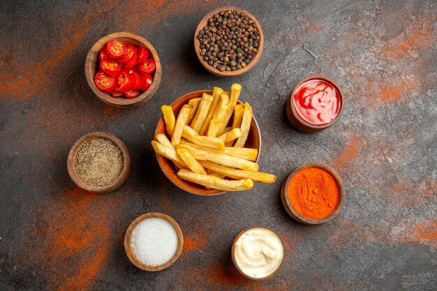 Top view of fried potatoes with potatoes served with ketchup and mayonnaise