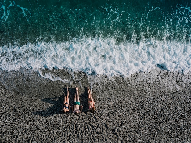 Free photo top view of friends relaxing at the beach