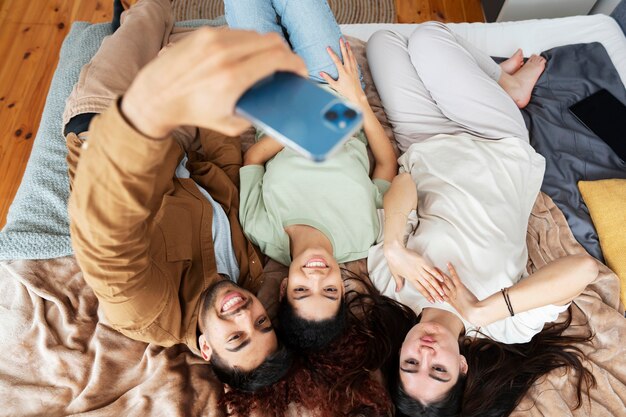 Top view friends taking selfie together