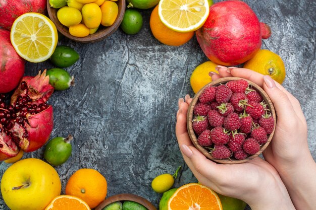 Top view fruit composition different fresh fruits on gray background