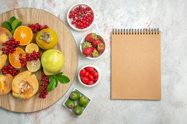 Top view fruit composition different fruits on white table