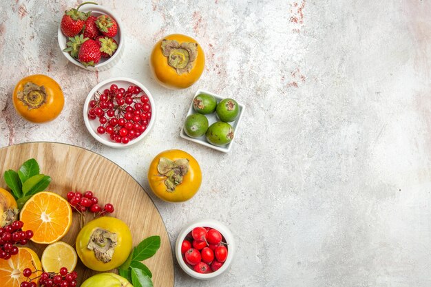 Top view fruit composition different fruits on white table