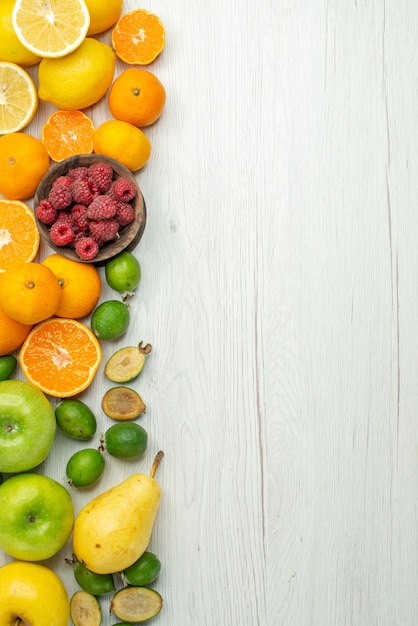 Free photo top view fruit composition fresh fruits on white background