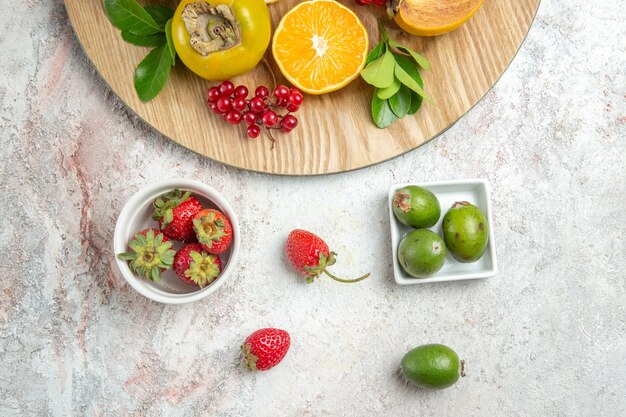 Top view fruit composition fresh fruits on the white table