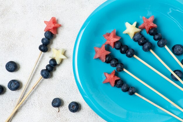 Top view fruit skewers on plate