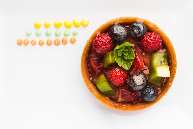 Top view fruit tart on plate with copy-space