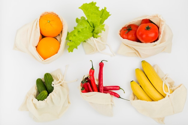 Top view of fruit and vegetables in reusable bags