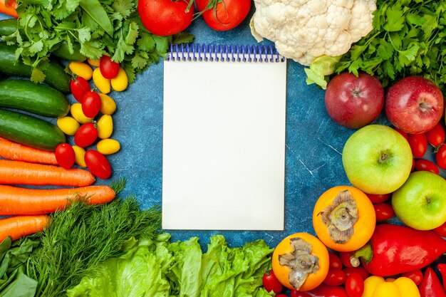 Top view fruits and vegetables on blue background