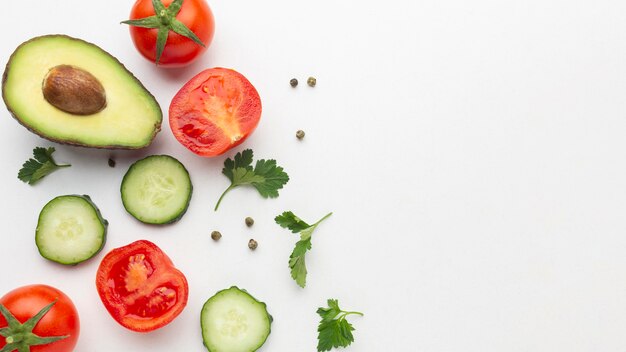 Top view of fruits and vegetables on white background