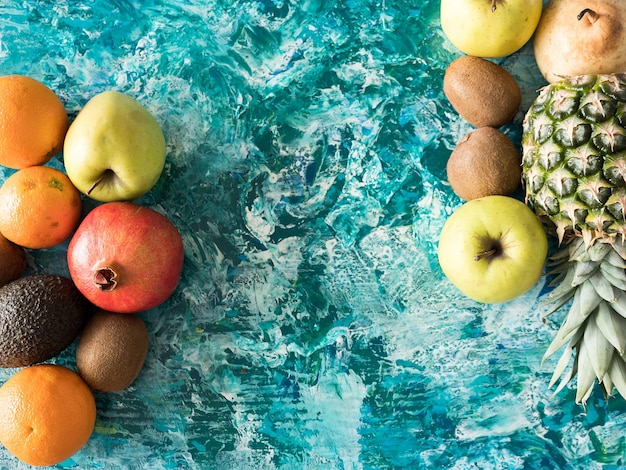 Top view of fruits on wooden background. Copyspace available