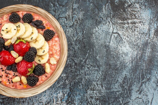 Top view of fruity muesli with fresh sliced fruits