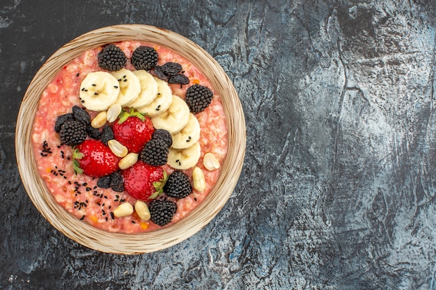 Top view of fruity muesli with fresh sliced fruits