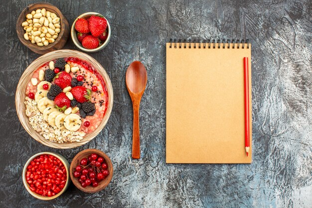 Top view of fruity muesli with fresh sliced fruits