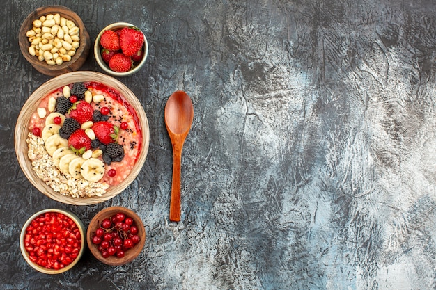 Top view of fruity muesli with fresh sliced fruits