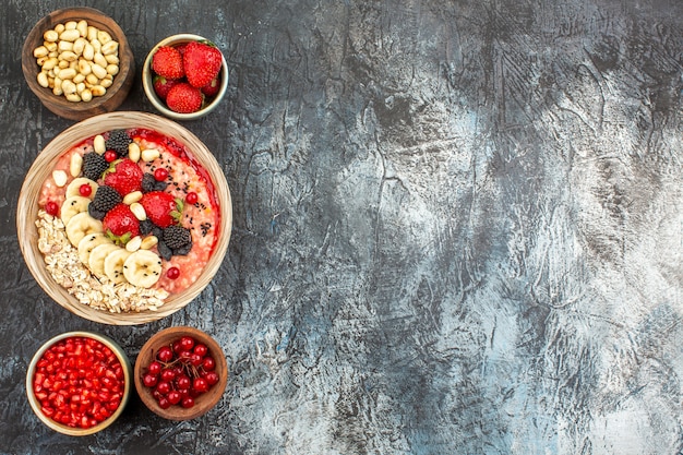 Top view of fruity muesli with fresh sliced fruits