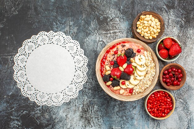 Top view of fruity muesli with fresh sliced fruits