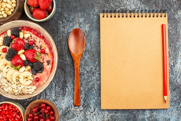 Top view of fruity muesli with fresh sliced fruits