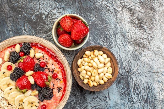 Top view of fruity muesli with fresh sliced fruits