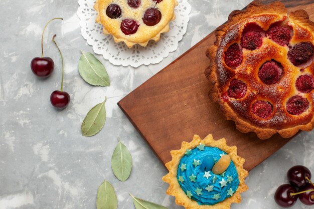 top view of fruity pie with raspberry cake on light, cake bake sweet fruit