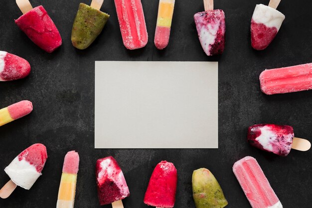 Top view of fruity popsicles with copy space
