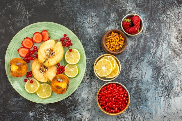 Top view of fruity salad with fresh sliced fruits