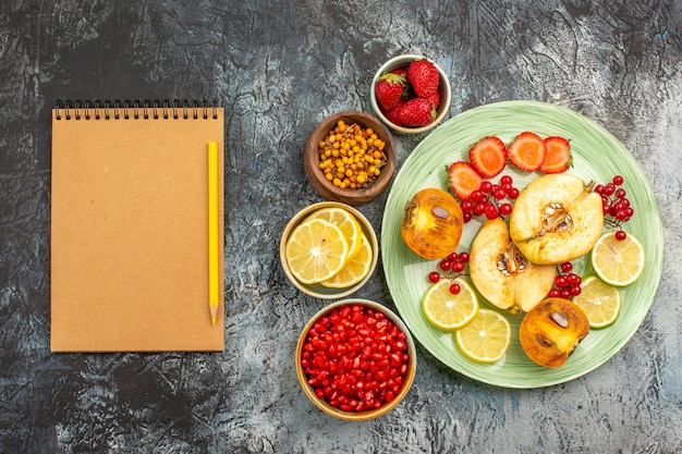 Top view of fruity salad with fresh sliced fruits