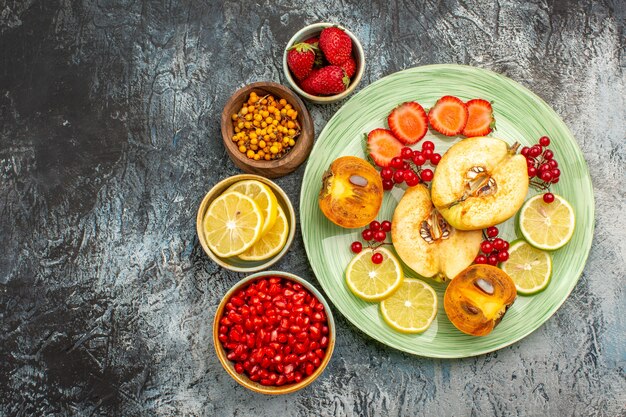 Top view of fruity salad with fresh sliced fruits