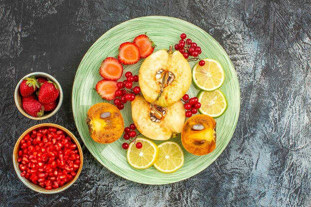 Top view of fruity salad with fresh sliced fruits